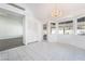 Bright dining area featuring tiled floors, large windows, and a chandelier at 60 Reyburn Dr, Henderson, NV 89074