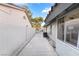 Exterior shot of a house side showing a fenced yard and exterior features at 60 Reyburn Dr, Henderson, NV 89074