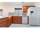 Well-lit kitchen featuring stainless steel appliances and tile backsplash at 60 Reyburn Dr, Henderson, NV 89074