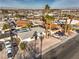 Aerial view of the property showcasing the house, surrounding neighborhood, and desert landscape at 6240 Clarice Ave, Las Vegas, NV 89107