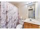 Bathroom featuring a marble-themed shower curtain, vanity and toilet at 6240 Clarice Ave, Las Vegas, NV 89107