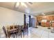 Open dining area featuring a tile floor, dining table, and direct access to the kitchen at 6240 Clarice Ave, Las Vegas, NV 89107