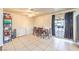 Dining area features tile floors, dining table, and sliding glass door to the backyard at 6240 Clarice Ave, Las Vegas, NV 89107