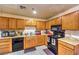 Well-lit kitchen equipped with essential appliances and ample cabinet storage space at 6240 Clarice Ave, Las Vegas, NV 89107