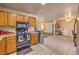 Kitchen with tile flooring opening to the living room and offering essential appliances at 6240 Clarice Ave, Las Vegas, NV 89107