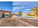 Inviting backyard with a quaint pool, covered patio area, and desert landscaping at 6240 Clarice Ave, Las Vegas, NV 89107