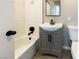 Bathroom featuring shower over tub with updated fixtures and white subway tile at 6421 Dinning Ave, Las Vegas, NV 89107