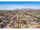 Expansive aerial view of a neighborhood with single-story homes and mountain views, showcasing community living at 6424 Old Colonial Way, Las Vegas, NV 89108