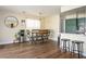 Open dining area featuring modern table and chairs, and adjacent to the kitchen at 6424 Old Colonial Way, Las Vegas, NV 89108