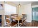 Bright dining area with modern table and chairs, and custom light fixture at 6424 Old Colonial Way, Las Vegas, NV 89108