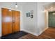 Entryway featuring modern wood doors and leading to the kitchen and living area at 6424 Old Colonial Way, Las Vegas, NV 89108