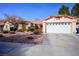 Charming single story home with low maintenance desert landscaping and two car garage at 6424 Old Colonial Way, Las Vegas, NV 89108