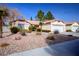 Charming single story home with low maintenance desert landscaping and two car garage at 6424 Old Colonial Way, Las Vegas, NV 89108