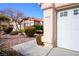 Garage and well maintained desert landscaping at 6424 Old Colonial Way, Las Vegas, NV 89108