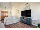 Spacious living room featuring wood floors, neutral paint, and ample natural light at 6424 Old Colonial Way, Las Vegas, NV 89108