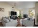 Bright living room featuring hardwood floors, shiplap fireplace, and comfortable gray sofa at 6424 Old Colonial Way, Las Vegas, NV 89108