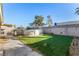 A large grassy backyard with an above-ground pool and a concrete block wall at 6717 Atwood Ave, Las Vegas, NV 89108