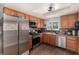 Kitchen with stainless steel appliances and wood cabinetry at 6717 Atwood Ave, Las Vegas, NV 89108