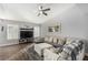 Bright living room featuring modern decor, wood floors, and a comfortable sectional sofa at 6717 Atwood Ave, Las Vegas, NV 89108