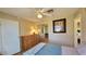 Bedroom with a ceiling fan, a dresser, and a view of the closet and hallway at 701 Bourbon St # G3, Pahrump, NV 89048