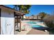 Outdoor pool with a lounge area, showers, and bright blue skies at 701 Bourbon St # G3, Pahrump, NV 89048