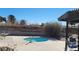 Outdoor pool with a lounge area for residents to enjoy on a bright day at 701 Bourbon St # G3, Pahrump, NV 89048