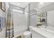 A bathroom features a tub/shower combination and white vanity sink at 7153 Tavita St, Las Vegas, NV 89113