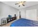 A bright bedroom with a dark wood floor and neutral walls at 7153 Tavita St, Las Vegas, NV 89113