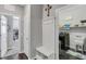 Well-organized hallway with laundry access, equipped with a practical storage bench and coat rack at 7153 Tavita St, Las Vegas, NV 89113