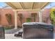 Backyard featuring a covered hot tub, perfect for relaxation and outdoor enjoyment at 7153 Tavita St, Las Vegas, NV 89113