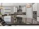 Modern kitchen featuring white cabinets, a large island, and stainless steel appliances at 7153 Tavita St, Las Vegas, NV 89113