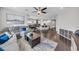 Open-concept living room seamlessly connecting to the dining area and kitchen, perfect for modern living at 7153 Tavita St, Las Vegas, NV 89113