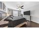 This main bedroom features dark hardwood floors and a ceiling fan at 7153 Tavita St, Las Vegas, NV 89113