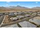 Aerial view of a desert community surrounded by natural desert landscaping and mountain views at 733 Aberdeen Tartan St, Las Vegas, NV 89138