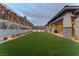 Serene backyard oasis featuring a green lawn, and a charming patio seating area at 733 Aberdeen Tartan St, Las Vegas, NV 89138