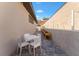 Outdoor dining area with views of the retaining wall and landscaped planter boxes at 733 Aberdeen Tartan St, Las Vegas, NV 89138