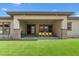 Covered patio with a barbecue and seating area overlooking a well-maintained lawn at 733 Aberdeen Tartan St, Las Vegas, NV 89138