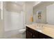 Well-lit bathroom featuring a single sink vanity, tile floors, and a shower-tub combination at 733 Aberdeen Tartan St, Las Vegas, NV 89138