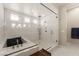 Modern bathroom with a glass-enclosed walk-in shower and a separate soaking tub at 733 Aberdeen Tartan St, Las Vegas, NV 89138