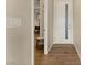 Bright entryway with hardwood flooring, neutral walls, and a modern white front door with a glass pane at 733 Aberdeen Tartan St, Las Vegas, NV 89138