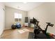 Bright exercise room with wood floors, a Peloton, exercise balls, and natural light at 733 Aberdeen Tartan St, Las Vegas, NV 89138