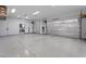 Large, clean garage with epoxy flooring, EV charging stations, and ample storage space at 733 Aberdeen Tartan St, Las Vegas, NV 89138