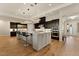 Open kitchen with stainless appliances, a large center island and pendant lighting at 733 Aberdeen Tartan St, Las Vegas, NV 89138