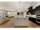 Open floor plan kitchen featuring a large center island with stainless steel appliances at 733 Aberdeen Tartan St, Las Vegas, NV 89138