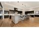 Open kitchen featuring a large center island with bar seating and stainless appliances at 733 Aberdeen Tartan St, Las Vegas, NV 89138