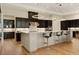 A spacious kitchen with pendant lighting, a large center island, and stainless appliances at 733 Aberdeen Tartan St, Las Vegas, NV 89138