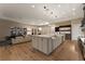 Open kitchen featuring a large center island and a stainless steel refrigerator at 733 Aberdeen Tartan St, Las Vegas, NV 89138