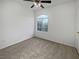 Empty bedroom showcasing neutral walls, carpeting, and bright window at 7400 W Flamingo Rd # 2022, Las Vegas, NV 89147