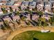 Gorgeous aerial view of neighborhood homes backing onto golf course, with mature trees and desert landscaping at 7505 Chaffinch St, North Las Vegas, NV 89084