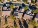 Aerial view of homes with solar panels with a view of the golf course at 7505 Chaffinch St, North Las Vegas, NV 89084